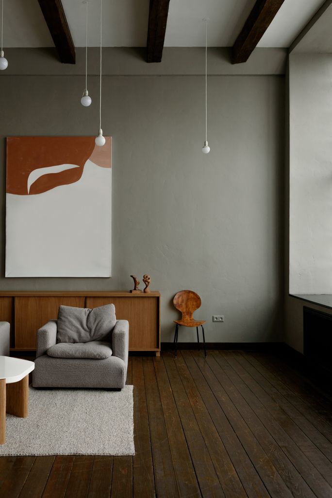 Stylish minimalist living room with modern furniture and neutral tones.